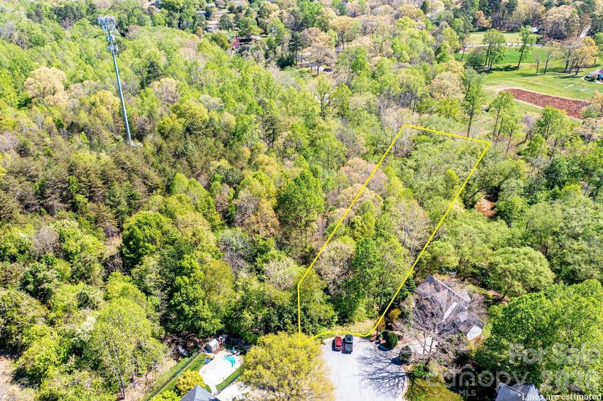 Experience the best of both worlds—wooded tranquility and city accessibility—in one of Hickory’s most established neighborhoods. Over One Acre on Falling Creek. The lot features city water and sewer availability, along with underground utilities and natural gas. With a manageable 1,500 heated square foot minimum for one story build requirement, this property is ideal for a variety of architectural styles; 2000 sqft for 2 story.  Low HOA dues ($120/yr).