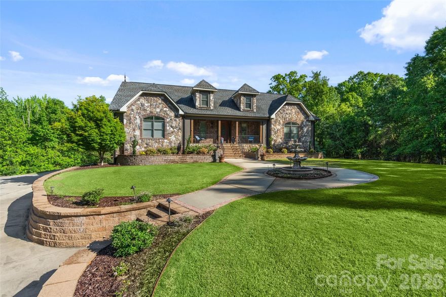 Tucked away on 2 private acres, this exceptional home offers the perfect blend of luxury, space, and versatility. The backyard is truly an oasis, featuring a saltwater pool with hot tub, outdoor fireplace, screened porch, and a composite deck—ideal for relaxing or entertaining in complete privacy.

Inside, you’ll find stunning details throughout, including coffered ceilings, expansive living areas, and a thoughtfully designed primary suite with dual closets and a split bath layout for added comfort and convenience. An elevator provides easy access from the basement to the main level.

The fully finished basement offers incredible flexibility, complete with a full kitchen, great room, full bath, and a theatre room with wet bar. While the theatre room cannot be counted as a bedroom due to no egress, it offers potential for additional sleeping space or even a second living quarters setup.

Additional highlights include a huge garage and abundant storage throughout. This one-of-a-kind property delivers privacy, function, and upscale features—perfect for multi-generational living or those who love to entertain!