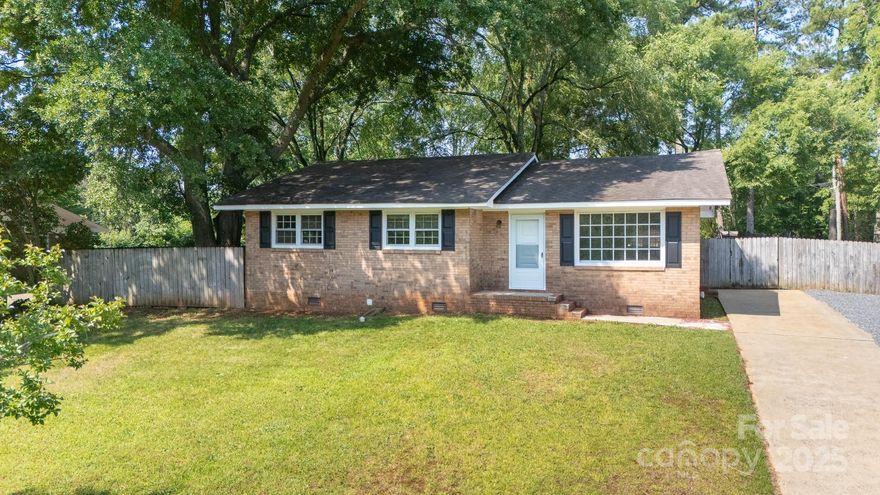 Charming, updated 3-bedroom, 2-bath brick ranch tucked in an established neighborhood! Step inside to an inviting open floorplan featuring rich hardwoods and sleek tile flooring. The kitchen shines with quartz countertops, a spacious pantry, and a layout designed for both everyday living and effortless entertaining. The front porch adds charm to the curb appeal, while the real outdoor living happens out back—grill, relax, or unwind on the covered patio in your private, fenced backyard. With easy access to the interstate, shopping, and dining, this home offers the perfect mix of style, function, and location!