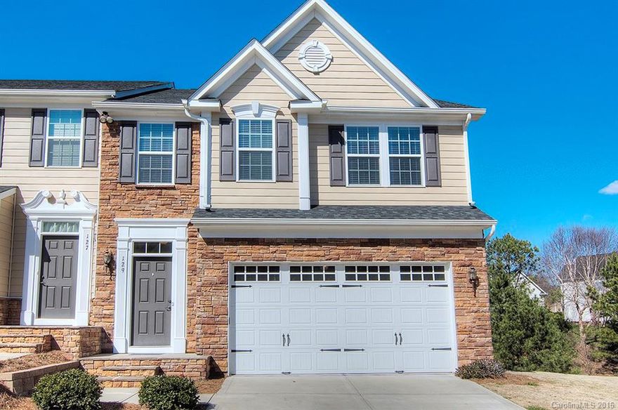 Gorgeous end unit  townhome with open floor plan. Upgrades include hardwood flooring & granite countertops. Lots of windows. Eat in Kitchen with breakfast bar. Spacious master bedroom with tray ceiling. Master bath has double sink vanity and garden tub w/separate shower. Two additional bedrooms on upper level. Finished basement has bonus room with study/office and full bath. Exterior maintenance managed by HOA. Located in sought after Tega Cay peninsula. Walk to lake, pool, trails, playground.