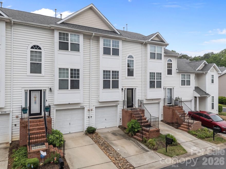 Welcome Home! Located in the desirable Mallard Creek area and offers a "Gated entrance "for both privacy and security. Complete with it's own community pool and clubhouse. Residents also enjoy direct access to Theresa Elder Park, providing convenient outdoor recreation just steps from home. Ideally situated, this townhome has quick access to Uptown Charlotte (see the city from pics). Inside, the home has been thoughtfully renovated with upgrades including brand new kitchen cabinets and granite countertops, new LVP flooring in kitchen, baths and foyer, new carpet throughout the the rest, freshly painted too. The kitchen also has stainless steel appliances, new dishwasher, stove and microwave. The refrigerator will also remain. A new water heater adds additional peace of mind! The HOA includes city water and sewer as well as trash services. Upstairs has owners suite with double windows for natural sunlight, new ceiling fan, walk in closet and private bath with dual vanity and soaking garden tub. The 2nd bedroom is also a nice size with hall bath serving this bedroom. Driving in, there is a one car garage and entrance to this level leads into a hallway with laundry closet, with new luxury vinyl and new light! There is also a spacious room that has double glass doors to patio. This area may serve as great flex space-perfect for home office, gym, entertainment area, game room or whatever works for you! To top it off, there is also a transferable home warranty as well as a termite warranty for 1 year. Please come and take a look, looking forward to your visit!