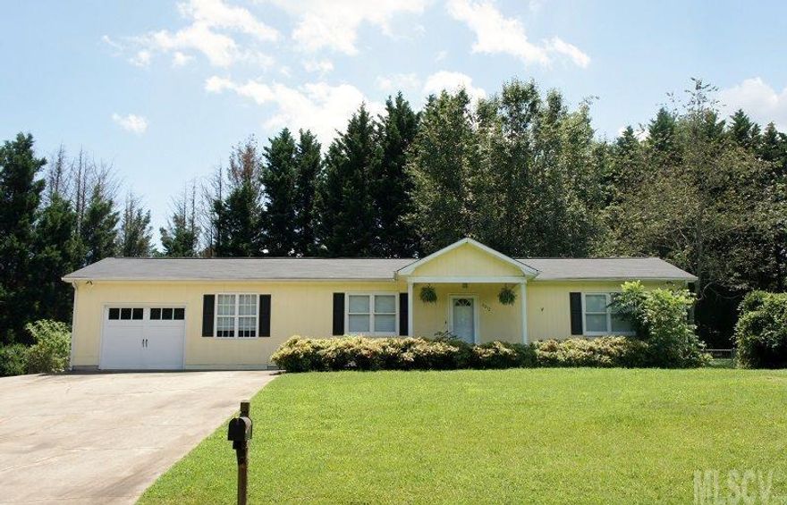 Private Home-Site/Renovated. This home features laminate wood floors throughout kitchen, great room and all bedrooms. Newer kitchen cabinets (some with glass fronts), tile back splash, refrigerator to remain. Neutral warm paint color, updated light fixtures,  heat pump 2010, ample closets, septic system upgraded. Walk out kitchen to patio and fence-in backyard surrounded by Leland Cypress trees for additional privacy. Finished room off the garage great for office, man-cave or craft room. Master bedroom has private bath, walk-in closet with built-ins. Enjoy this quiet development and walk down to Lake Hickory. No city taxes.