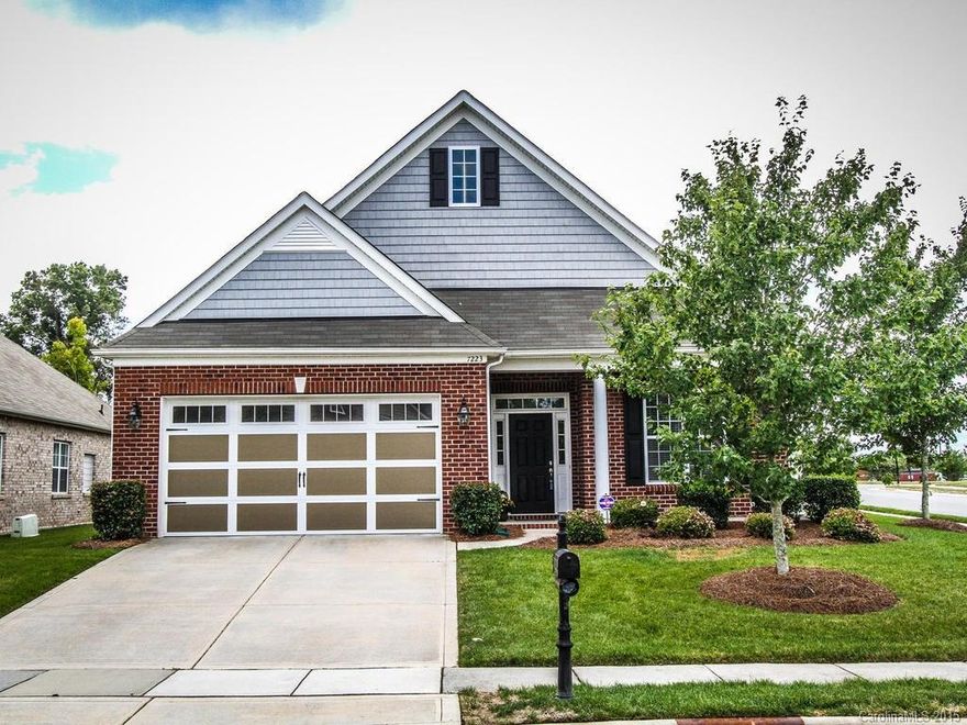 Full brick ranch in desirable Stone Creek Ranch. Beautiful hardwoods throughout, recessed lighting, skylights, detailed moldings, trey ceilings in formals and master bedroom, ceiling fans, built in speaker system (4 areas), ceramic tile bath & laundry floors, and fenced backyard.  The dream kitchen features a large island, granite countertops, 42" cabinets, and SS Kitchenaid appliances. Spacious walk-in closet and private bath in master suite. 3rd bedroom (no closet) has lovely French doors.