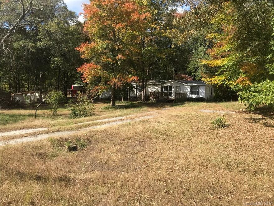 Great piece of land on a quite Cul-de-sac! Over 3 acres! 3 bed 2 bath manufactured doublewide with block underpin. Property does need some work but great value. Listed under tax value! Out buildings on property for extra storage! Property being sold "AS IS"!