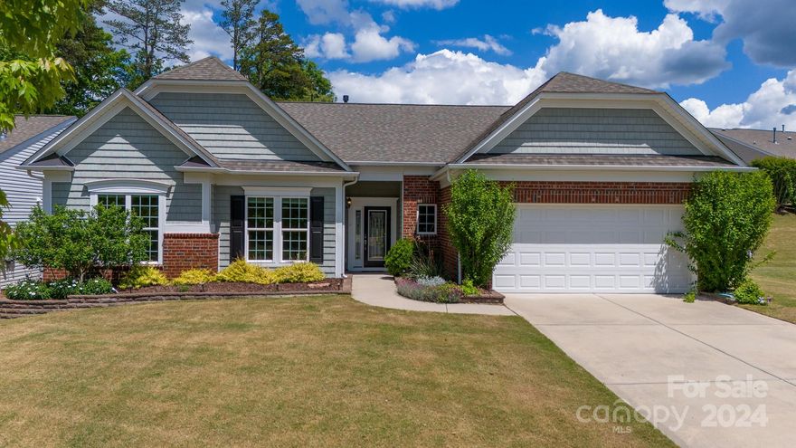 Must-see Ranch home, tons of natural light, and a beautiful, enclosed patio with a private view! Large kitchen with upgraded  appliances, granite counters, a gas range and walk in pantry.  Enjoy meals in the breakfast nook or formal dining room.  The open great room has a tons of windows,  gas-log fireplace and a floor outlet to make decorating a breeze.  The enclosed patio has a ceiling fan and large windows that can be opened to create a screened porch overlooking the private backyard!  It leads outside onto an oversized patio for grilling and entertaining.  Primary suite has a tray ceiling, 3 large windows and a bathroom with dual sinks, a frameless glass shower with tile and a massive walk-in closet!  This 55+ Del Webb community is waiting for you to come join the active adult lifestyle it has to offer!