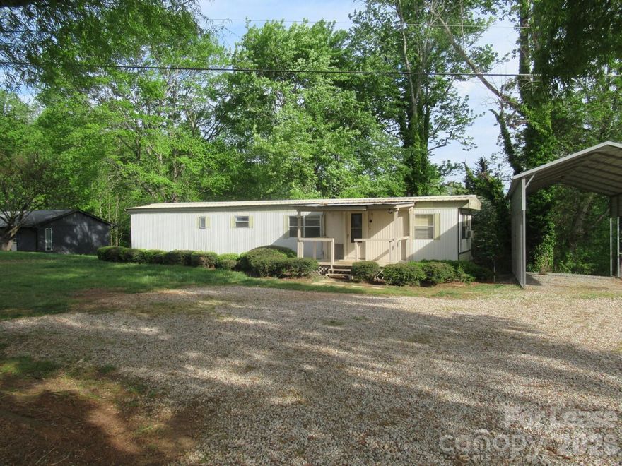 Location, Location, Location – Sherrills Ford Area!  This 2-bedroom, 1-bath single wide home is ideally located on Hwy 150 in the desirable Sherrills Ford area, just minutes from public Lake Norman access, boat launches, shopping, dining, and more. Enjoy the convenience of a quick commute while still having access to all the benefits of lake-area living.  The home features a spacious den, a functional galley kitchen, and a dedicated dining area, providing a comfortable and practical layout. Step outside to the covered front porch—perfect for relaxing or entertaining.  Pet-friendly with a one-time, non-refundable pet fee (maximum of one pet). No indoor smoking or vaping. Application required. Credit and background check may apply. Security deposit required.