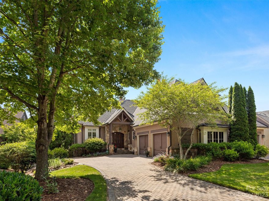 Welcome home to The Meadow, where serenity and world class amenities provide a gracious mountain lifestyle. Whether you’re interested in a permanent residence or a “lock and leave” seasonal respite, this tranquil stone townhome beautifully blends rustic-mountain style with elegant finishes. Conveniently located near a members-only gate and a short drive to the Clubhouse Tavern, golf course, and Wellness Center. The open concept floor plan and main level living features a spacious great room with fireplace; kitchen with a large chef's island, Wolf cooktop and Subzero refrigerator/freezer; and primary bedroom suite. The covered porch with fireplace and terrace overlook the peaceful park-like setting and community pond with short and long range mountain views. Phantom screens extend your outdoor living and connection to nature throughout the year. The lower level boasts two guest suites, an open family room leading outside to the lower patio and yard, and a bonus room for office or media.