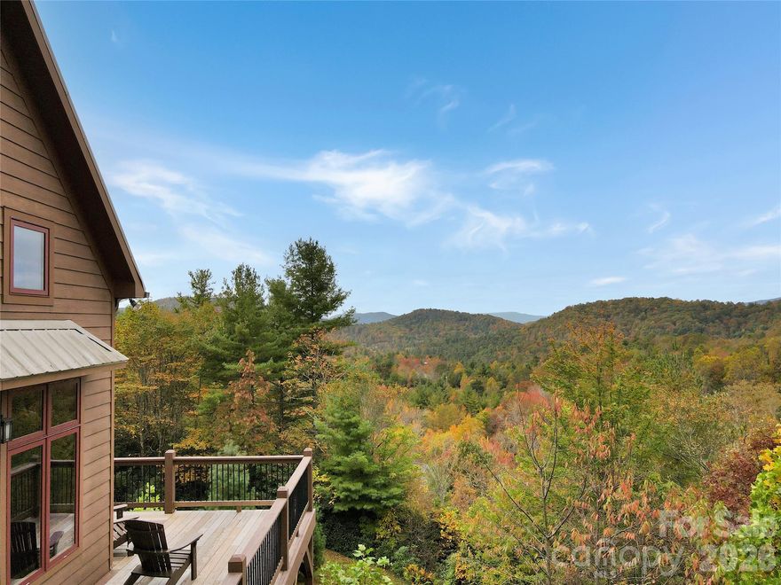 If the mountains are calling -- this is it.  Welcome to 6365 Julius Drive, where the views stretch forever and the pace of life slows down. This modern mountain cabin retreat delivers the best of the High Country—privacy, land, long-range panoramic views, and easy access to the area’s most loved destinations, all wrapped into a home that feels warm, inviting, and unforgettable.

Set at approximately 3,800 feet elevation on a nearly 3-acre lot, this property is made for anyone craving space to breathe and room to unwind. Whether you’re sipping coffee while the mountains wake up, listening to the wind in the trees, or gathering around a fire after a day on the Parkway, this is the kind of home that instantly feels like an escape.

Inside, the cabin-style charm meets modern comfort with an open layout and a stunning great room featuring vaulted ceilings and beautiful tongue-and-groove woodwork throughout. The living, dining, and kitchen areas flow together perfectly for entertaining, while expansive windows frame the long-range views like a piece of living art. Front and center, a dramatic two-story stone fireplace anchors the space—creating the cozy mountain atmosphere everyone wants, and offering efficient heat for snowy winter evenings.

The main level includes a guest bedroom, full bathroom, and laundry room, plus generous covered and uncovered decking—perfect for grilling, dining outside, or relaxing with a book while surrounded by nature. Upstairs, the primary suite is a private getaway of its own, complete with a private deck and en-suite bath—ideal for sunrise moments and peaceful nights under the stars. There’s also an additional upstairs room that works beautifully as a bonus space, office, or extra guest room.

Downstairs, the finished basement adds even more flexibility with an additional living or game room, a bedroom, a full bathroom, and plenty of unfinished storage space for mountain gear, tools, or seasonal items.

And when it’s time to explore, you’re perfectly positioned—just minutes to the Blue Ridge Parkway, with quick access to Banner Elk, Linville, Grandfather Mountain, Newland, and the shopping and restaurants of the High Country. Whether you’re looking for a full-time home, a vacation escape, or an investment-friendly getaway, this property checks every box—plus it’s sold furnished, so you can start enjoying it right away.

End your days with sunset views, quiet skies, and the kind of peace you can only find in the mountains.