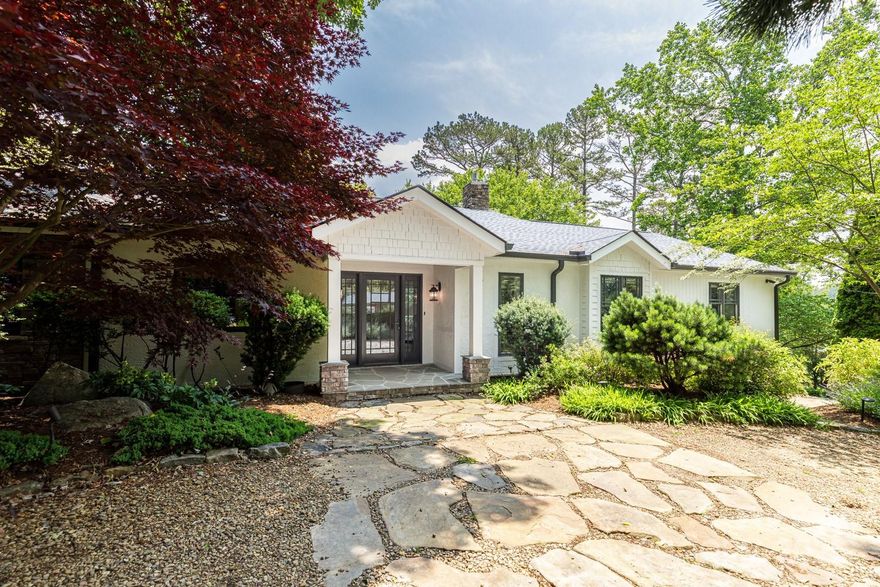 Back on market due to no fault of the home! Beautifully updated home in Lakeview Park, on the golf course & walking distance to Country Club of Asheville. Professionally landscaped lot with views of golf course & mountains. This gracious home features vaulted beamed ceilings in the living area, fireplace w/built-ins, & a reading nook with wall-to-wall bookcases. The open kitchen, dining and living areas flow into large screened porch, open decks, and patio. Main level offers 3 bedrooms, two full baths, & laundry room w/pantry off the kitchen. Primary suite includes newly renovated bath w/soaking tub & shower in a glass & tile wet room, heated floors, & custom cabinetry. The terrace level features a 3rd full bath, flexible bonus spaces for office, gym, guest suite, and/or media room. Just 3-5 minutes from Beaver Lake & North Asheville shops & dining, & 7 minutes to downtown Asheville, this home offers tranquil living in one of Asheville’s most sought-after neighborhoods.