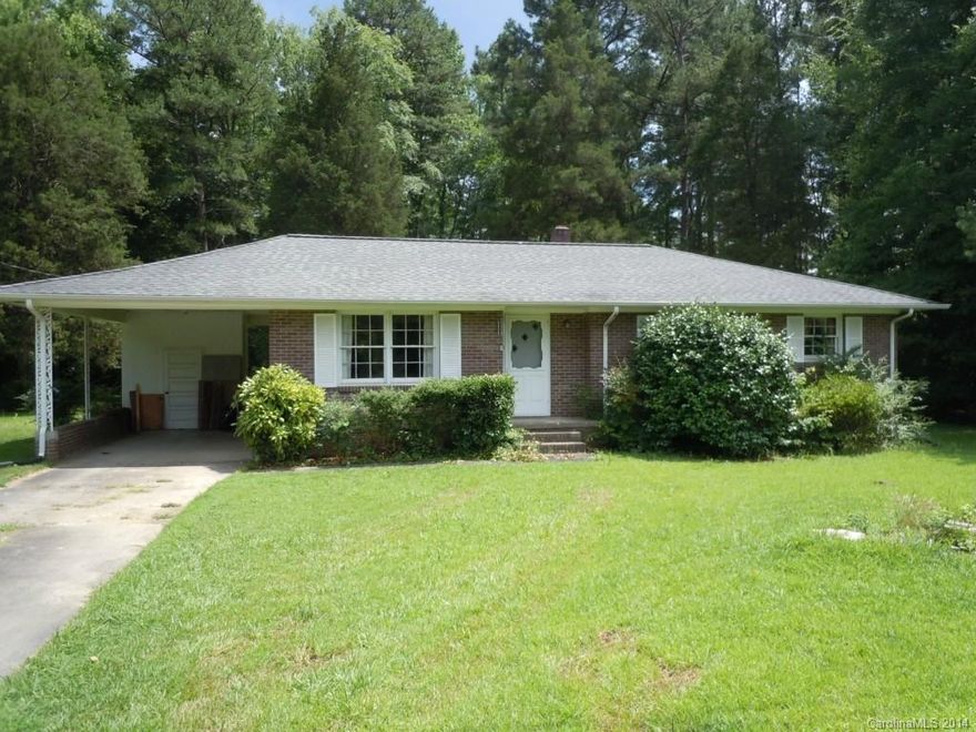 Great brick ranch with beautiful  hardwoods. Home has an attached carport and is located outside the city limit and would be perfect 1st home or downsize option. Adjoining lot available 621-01-01-005.  Perfect for addition of garage and or workshop; plenty of garden space.See it today.