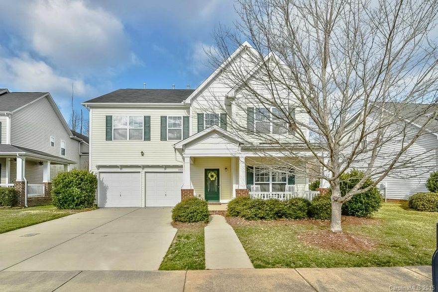 Gorgeous, one time owner meticulously maintained sits on beautiful street. Home boasts lovely rocking chair front porch, gleaming wood floors, open layout w/fabulous gourmet kitchen perfect for entertaining, elegant and spacious formal dining room, large and cozy family room. Upper level offers a convenient open loft space and very generous size bedrooms w/ extra large closets.  A lovely yard w/beautiful landscaping for effortless living is featured as well.  One year home warranty included!