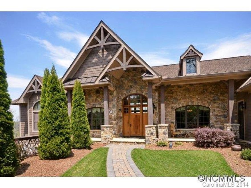 Outstanding custom home with commanding mountain views, 3 - car garage and built in 2009. Thoughtfully designed floor plan that allows for open living,large windows to capture the views, two exterior decks and screened porch that feels like an interior room with built - in grill, ceiling fan and fireplace.  Home also boasts expansive kitchen with two beautiful islands, a deluxe master suite and bath and lower level bedrooms for guest suites