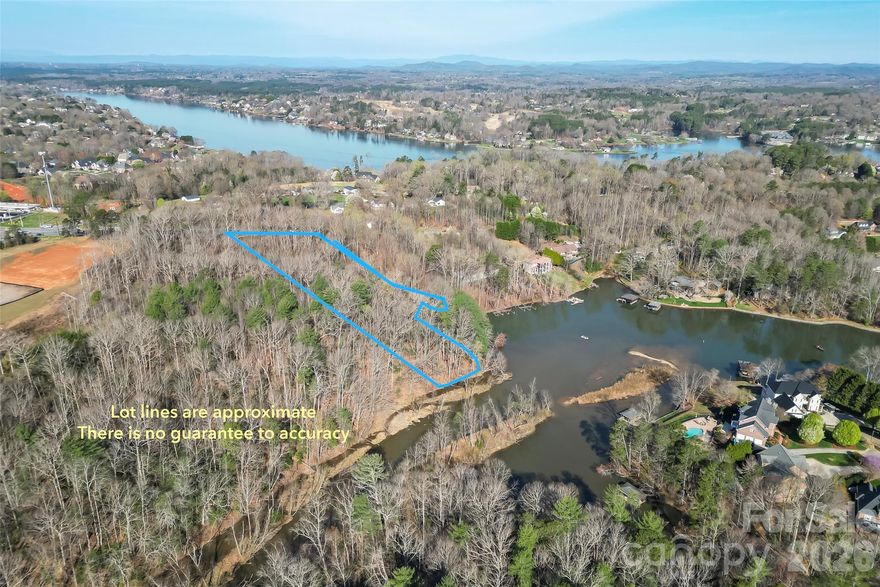 Discover one of the few remaining lots on the shores of Lake Hickory, nestled in the heart of the North Carolina foothills! This parcel offers unobstructed water views and direct lake access with a sea wall already in place, and a boat dock. Situated in a highly sought-after location in Hickory, this lot places you just minutes from the downtown scene,top rated dining, and shopping. Make it yours today!