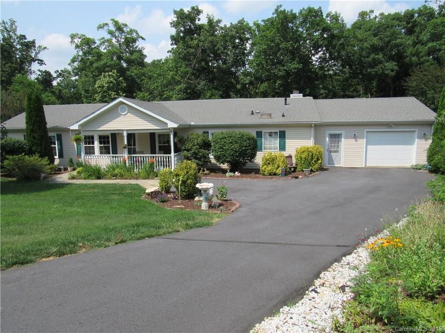 BACK ON THE MARKET! Buyers financing fell through. Amazingly well maintained home in a very convenient location in Arden, minutes to the airport. 2 living rooms, open floor plan, beautiful hardwood floors, lots of updates, on demand hot water heater, 1 and a half car garage with workshop, lots of room for storage. Covered front porch surrounded by beautiful perennial flowers. Private back deck for grilling, bathrooms updated. Lots of closet space. Stay warm, includes generator.