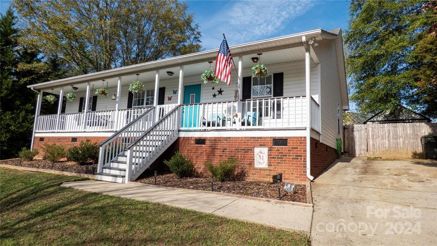 Welcome to this charming 3-bedroom, 2-bath ranch-style home. The inviting rocking chair front porch is perfect for sipping a morning coffee or unwinding at the end of the day, which you can do with your furry friends due to the gate that keeps them securely on the porch. The Great Room, with its vaulted ceiling and gas fireplace, creates an inviting atmosphere for family gatherings or quiet nights in. Low-maintenance laminate wood flooring makes cleanup a breeze. The home’s split bedroom layout offers a private retreat in the primary bedroom, complete with a walk-in closet and ensuite bath. All bedrooms have ceiling fans for your comfort. Step outside into the backyard, where you can enjoy the deck and a privacy fence that provides a secure environment. The outbuilding has electricity and air conditioning offering endless possibilities for storage, hobbies or crafts. This home has been recently pressure wash giving it a fresh, clean look. Schedule your showing today!