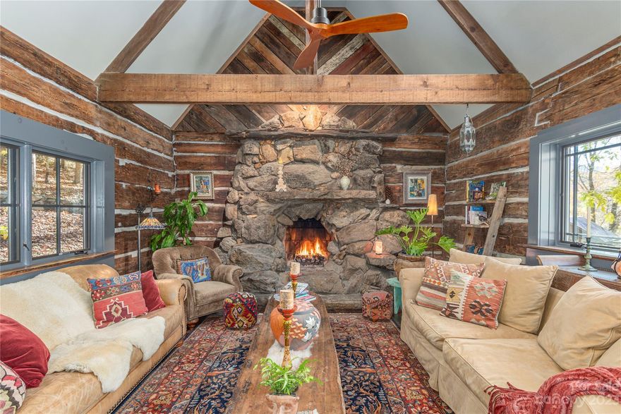 A Modern Rustic Masterpiece. This artfully designed & crafted home seamlessly combines a refurbished cabin from the 1800’s w/a newly constructed interior, creating a one-of-a-kind awe-inspiring dwelling. Blending rustic charm w/modern amenities and comfort including two magnificent stone FP's, exquisite live-edge wood detailing. This home sits on 9 beautiful acres offering endless features, vistas of meadows and mountains, a flowing stream, rock outcroppings, two rock fire circles & plenty of open land for crops or farm animals. It's fully solar-powered, w/a Tesla backup system & high speed fiber optic internet. The magic of the offering is enhanced w/a detached office/studio for creative pursuits & a charming cottage for guests, friends or for STR. Bordering the Pisgah Nat'l Forest, this breathtaking property promises privacy, beauty, comfort & a lifestyle in harmony w/nature. A unique & magical property that must be experienced to be believed! Be sure and watch the virtual tour.