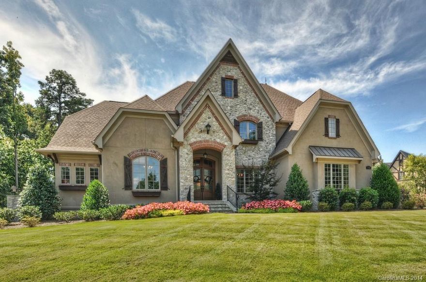 Visit the virtual tour link for more pics & info. You will be impressed with the detail of custom home. Gourmet kitchen large island, top-line appl, & bar. Opened to Keeping Rm w/stone FP & Great Rm w/Limestone FP. Main lvl Master suite features 2-WICs, exercise rm, steam shower, coffee bar & laundry. Upper level boasts 3 bdrm suites, study area, bonus rm & 2nd laundry. Enjoy the outdoors:Covered porch, bar, stone FP, grill, heated pool/spa, 1/2 bath & outdoor shower. Bslip & lift across the way