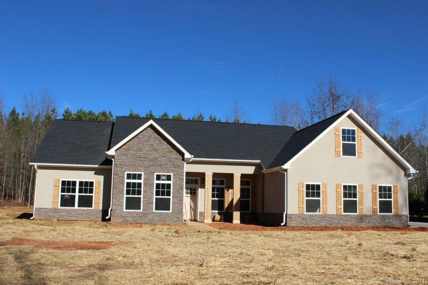 Discover The Estates at Glenmoor in historic York, S.C. "The Charleston of the upstate." 5 min. outside of town with 1 acre lot. This one is close to being finished. Exquisite detailing w/oversized owner's retreat, large great room,formal dining and an impressive 2 story library. You get the works with hardwood floors, tile floors and granite countertops plus two porches for outdoor living.