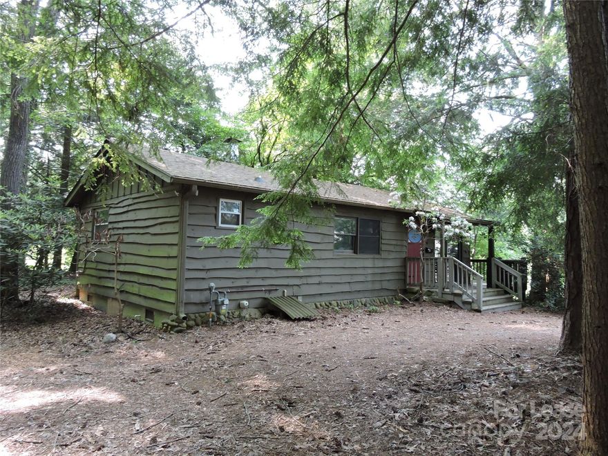 Cottage on a private wooded lot. Secluded away from traffic. Open floor plan. Kitchen/ dining/ living room with stone fireplace. Washer/ dryer included. Private deck. Secluded away from traffic and noise yet situated in an upscale neighborhood. Water is included. Only minutes to downtown Black Mountain, Asheville and the Blue Ridge Parkway. Available July 1, 2024 but can be shown most anytime including evenings and weekends.