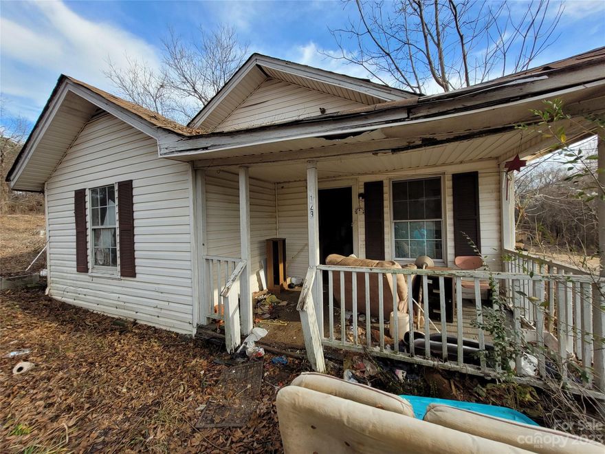 Tucked away, this former duplex is in need of some attention. There are a couple of leaks in the roof that caused failure in a bedroom. There are also a few soft spots throughout the house that need attention. It sits on 0.34 acres of unrestricted land which allows for endless opportunities including, mobile homes, RV's, and tiny homes. 1 hour from Charlotte and 1 hour from Asheville. City water, septic were installed many years ago.