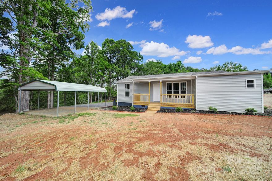 Back on the market with MORE to offer! USDA 0% DOWN PAYMENT FINANCING AVAILABLE FOR QUALIFIED BUYERS! This fully renovated, move-in ready modern ranch now includes two parcels totaling 1.59 acres, featuring an additional adjacent lot—perfect for added privacy, future expansion, or investment potential.

Inside, you’ll find a stylish open-concept living area with luxury vinyl plank flooring, recessed lighting, and a bold black accent wall with a built-in electric fireplace. The updated kitchen showcases laminate countertops, white shaker cabinets, and stainless steel appliances. Both bathrooms have been beautifully remodeled with custom vanities and sleek matte black finishes.

Major upgrades include a new roof, HVAC system, plumbing, electrical, siding, and covered front and back porches—giving you peace of mind for years to come. A freshly painted 336 sq ft basement provides flexible space for storage, hobbies, or a workshop.

Enjoy a private, tree-lined setting with a new gravel driveway and metal carport plus the space of the extra lot next door.

Conveniently located just minutes from Hwy 74, Shelby, Cherryville, and Lincolnton, this turnkey property offers modern comfort, extra space, and exceptional value.
