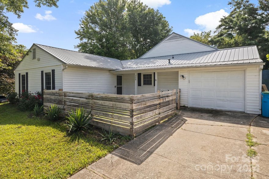Welcome to Mount Carmel Acres! Located just outside the Asheville city limits, this spacious ranch-style home is ready to be your gateway to all Asheville has to offer. Nestled in a cozy neighborhood north/northwest of downtown Asheville and West Asheville, you'll find yourself just 12 minutes away from the heart of it all. With 5 bedrooms and 3 full bathrooms, mornings and evenings will be a breeze.The main living area is an open floorplan featuring a kitchen with an in-island cooktop/stove, overlooking the family room and game room.  Step outside to your private fenced backyard oasis, complete with a gas grill, hot tub, outdoor dining area, wood fire pit, with ample space. Currently a profitable short term rental minutes from Downtown and West Asheville. Don't miss out on this opportunity to make Mount Carmel Acres your home base in Asheville! Schedule your showing today and start making memories that will last a lifetime.