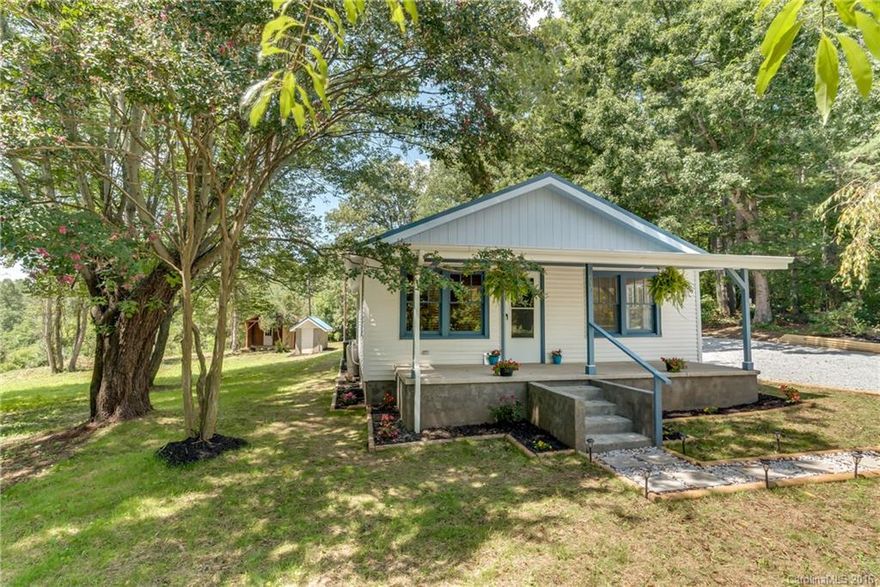 MOTIVATED SELLER!! UPDATES GALORE IN THIS GREAT BUNGALOW ON 2.93 ACRES! A SHORT DRIVE TO FOUR SEASONS & MAIN STREET HENDERSONVILLE PLUS ROOM FOR YOUR ANIMALS. ALL NEW FEATURES INCLUDE: SUPER HE BRYANT HP +DUCT WORK; METAL ROOF; COMPLETE BATHROOM; WATER HEATER; ALL APPLIANCES; MOST FLOORING; GUTTERS; LIGHTING; FRONT PORCH ROOF; R-30 ATTIC INSULATION; LANDSCAPING...WOW! THIS HOME IS MOVE IN READY INCLUDING THE NEW GAS FP & FLAT SCREEN TV. EVEN THE OUTBUILDING/WORKSHOP HAS BEEN UPDATED W/220 WIRING
