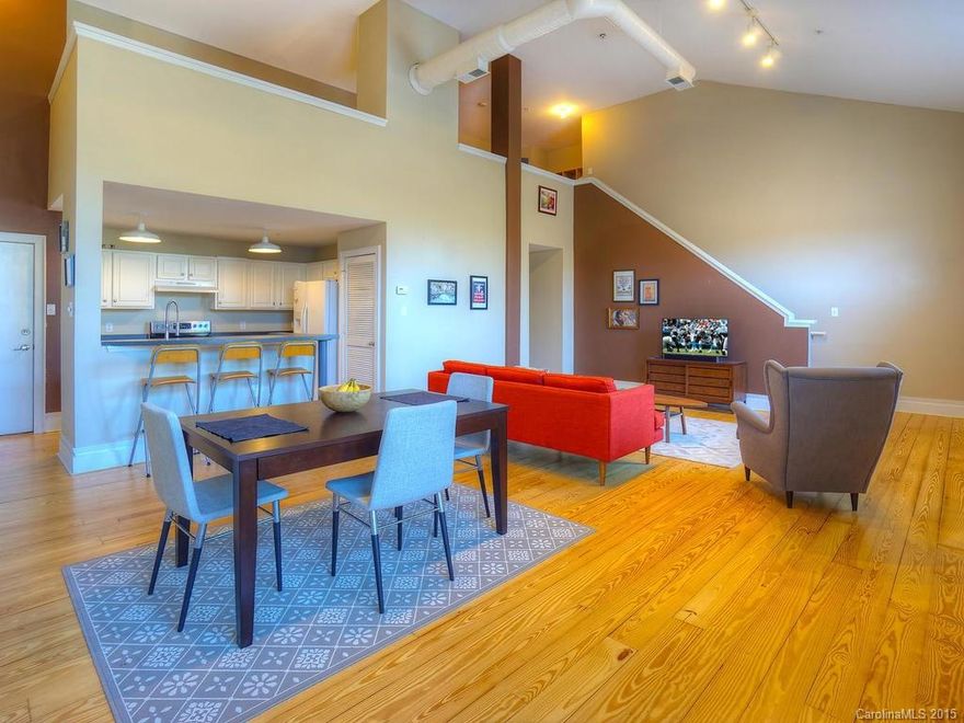 Beautiful spacious OPEN condo in the heart of Elizabeth! Hardwood flooring thru out just refinished! New stainless steel oven. 24ft ceiling! Gated parking garage with assigned space. Plenty of outside parking too. Elevator with coded entry.  Within walking distance to Hospitals and Elizabeth Avenue Shops & Restaurants. Great access to new streetcar line to Uptown Charlotte.