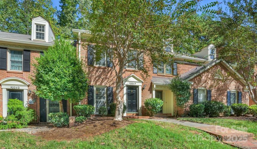 Move-in ready townhome in desirable Sardis Forest Patio Home Community. This updated 2-bed, 1.5-bath home features a bright kitchen with granite countertops, stainless steel appliances, white cabinetry, and bar open to family room.  The open living area flows to a private fenced brick paver patio, backing to wooded common area, perfect for relaxing or entertaining. Upstairs offers two spacious bedrooms and an updated full bath. Additional recent updates include new double-pane windows (2021) New flooring on stairs, and new updated bannister completed within the past year. A beautiful community with sidewalks, lush trees and landscaping.  A short distance to downtown Matthews, as well as Cotswold, Southpark, Galleria Shops, McAlpine Greenway, restaurants and entertainment.  A great unit, hard to find at this price point!