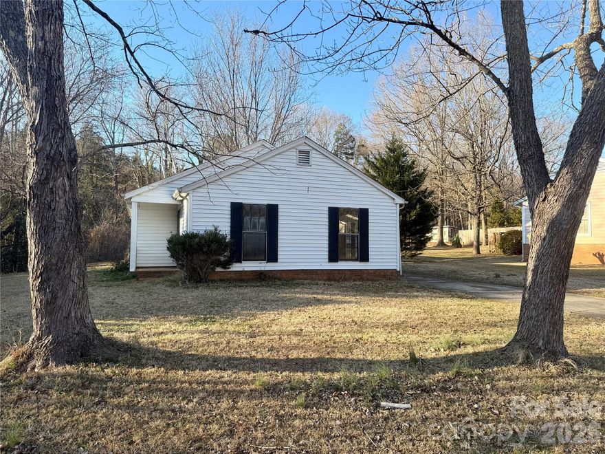 INCREDIBLE price for the Mint Hill Area and in a PRIME LOCATION! NO HOA! A 2 bed, 1.5 bath home on a LARGE lot with GREAT potential! This home features a good sized front porch, LARGE living room, LARGE kitchen with a conveniently located laundry closet, a good sized primary bedroom with double closets and ensuite bath, a good sized secondary bedroom, and a well positioned half bath. This home includes with a spacious outdoor shed too! Minutes from Downtown Mint Hill, Albemarle Road, Matthews, East Independence Blvd, and I-485! Less than 30 minutes from Uptown Charlotte and less than 40 minutes from the Charlotte Airport! The home does require cosmetic work, but it has solid bones! This is a perfect home for investors, general contractors, landlords, and buyers who love taking on projects! Home to be SOLD AS IS.