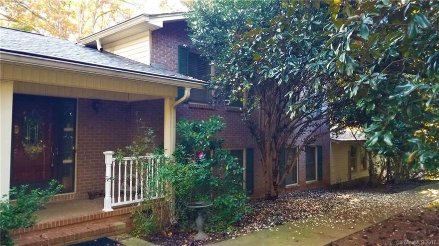 4 Br / 3 Ba tri-level in quiet neighborhood, private wooded lot on 1.1 Acres, 3 bedrooms on upper level, including master and 2 full baths. Foyer with French doors to formal living room, dining room, hardwoods throughout, spacious kitchen with breakfast nook.  Lower level features den with gas fireplace, bedroom / bonus room, sunroom leads to patio, double garage w/ workshop,  additional detached workshop and storage in fenced back yard.