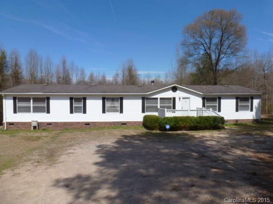 Country living on this 4 acre property with spacious Dblwide that features 4BR’s, 2BA’s, over 2000 sq. ft., GR with fireplace, large kitchen with all appliances, lots of cabinets, fml dining, MBR has walk-in closet, sitting area, MBA has garden tub, separate shower and dbl vanities. Large deck. Come home to peace and quiet.