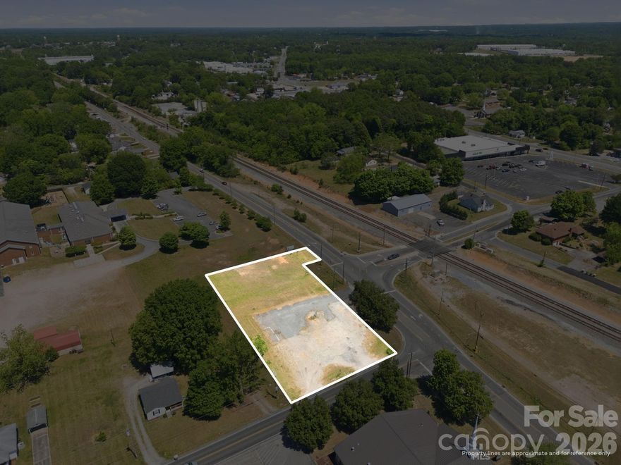 Positioned at a highly visible corner, this ±0.878-acre parcel offers a prime opportunity in the growing market of Kannapolis. Located at the intersection of W. 22nd Street and N. Main Street, the property benefits from excellent road frontage and strong exposure along a well-traveled corridor.

Zoned General Commercial, this versatile lot allows for a wide range of development options, including retail, office, service-based businesses, and residential use—making it an ideal investment for developers, builders, or owner-users seeking flexibility.

With level topography and convenient access to nearby amenities, this site is well-positioned for future growth. Whether you're looking to establish a business presence or develop residential units in a high-demand area, this corner lot presents a unique opportunity to capitalize on the continued expansion of Kannapolis.

Parcel includes all of 160 122 and part of 160 121.  Recent survey to redraw lot lines.  Kannapolis city utility map also available.
