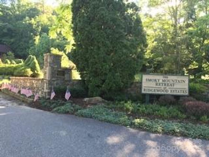 Located in the upscale community of Smoky Mountain Retreat at Ridgewood Estates, this lot is being offered at below tax value.  City Water and Sewer well maintained roads and outstanding long range views.  Conveniently located near Waynesville Country Club as well as downtown Waynesville shops and restaurants.