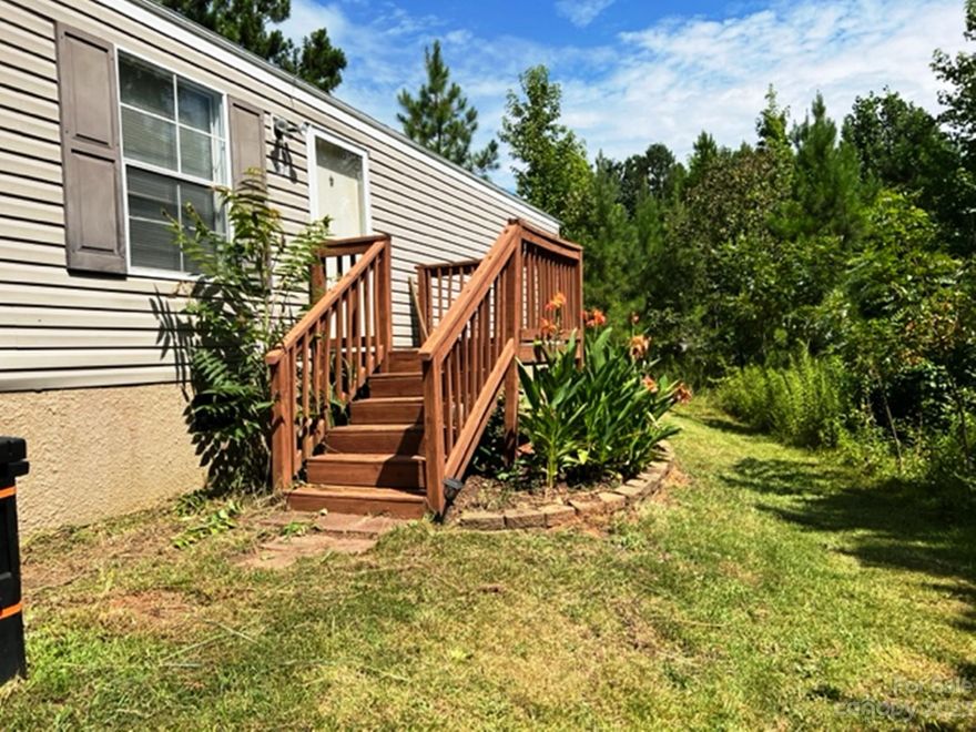 Looking for privacy? Look no further. The perfect private TWO ACRE retreat with NO HOA in a Great location close to I-77. This Lovely open layout hideaway boasts 4 bedrooms, 2 full bath, a spacious kitchen and primary suite ready for a relaxing soak. Long driveway brings you home to serenity complete with views, storage, plant boxes, fruit trees and Chicken Coop. Call for a showing today!