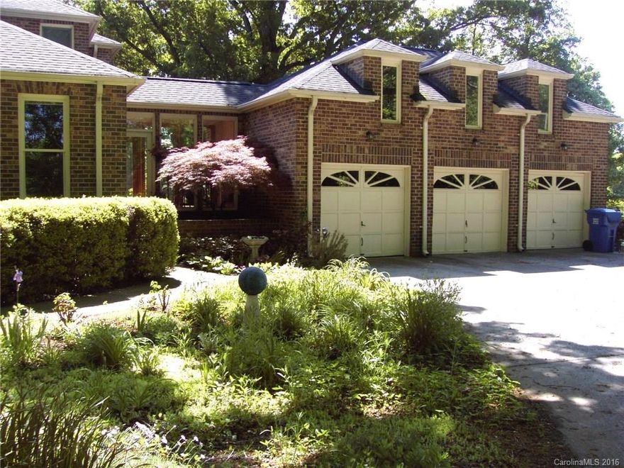 Brick Georgian 2 story on private 5 acre lot wooded in rear (4.91 acres) Existing vintage barn over 120 yrs old can be restored or torn down & barn wood/beams sold. Many huge 325 yr old ancient oaks on property. Breathtaking in summer!  Master suite on main. 3 fireplaces..MBR, Kitchen & GR. 3 addl bedrooms up plus an office.  2nd stairway to private bonus room over the 3 car garage. Home has a fenced pasture/FOR PERSON LOOKING FOR LAND & PRIVACY & KNOWS THIS STREETS HIGH LAND VALUE/NOT A MANSION