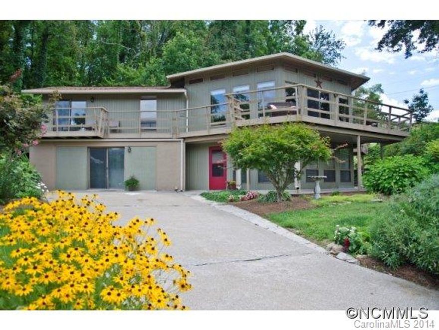 Recently updated contemporary mountain retreat home with abundant light, lots of space, and open floor plan. Wrap around deck on the front of the house with majestic mountain views. East access to walking paths around the Lake.  Updates include quartz counter tops, HVAC, and roof. The basement living area offers options for long term rental, mother in-law suite, or weekend guests. Close to 5 premium golf courses, 10 minutes to Waynesville!