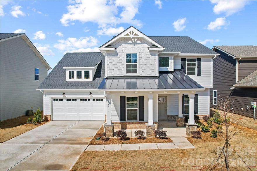 Experience elevated living in the Northridge quick move-in home, now ready in Forest Creek. This statement-making home welcomes you with a stately front porch and continues to impress inside with a thoughtfully designed layout and upscale finishes throughout. The gourmet kitchen is truly the heart of the home, featuring elegant, white cabinetry, quartz countertops, a spacious island, and a beautifully appointed butler’s pantry that seamlessly connects to the formal dining room - perfect for entertaining in style. The gathering room has warmth and architectural charm plus enjoy seamless outdoor living on the covered porch - the perfect space for quiet mornings and relaxing evenings. A private first-floor office provides the ideal work-from-home space. Just off the oversized garage, the mud room with planning center keeps daily life effortlessly organized. Upstairs, retreat to the luxurious owner’s suite complete with a tray ceiling, spa-inspired bath with a large walk-in shower, and separate his-and-her closets. Three additional bedrooms - including one with a private bath - plus an additional hall bath, spacious loft, and conveniently located laundry room complete the second floor. This is luxury, space, light, and functionality perfectly combined - and it’s ready for you now. Buying new also means enjoying today's most desirable home designs, energy efficient construction, and the confidence of a builder backed warranty. Forest Creek will offer thoughtfully designed amenities including a pool, clubhouse, pickleball courts, playground and peaceful walking trails. Located minutes from the town of Waxhaw, you'll enjoy convenient access to shopping, dining, and top-rated schools while still coming home to a peaceful community setting.