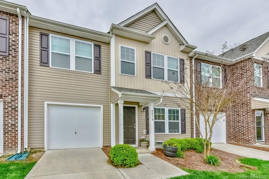 Enjoy this beautiful townhome and all the amenities it surrounds!  Hardwood floors throughout main level with open kitchen featuring granite counter-tops, stainless appliances, center island, breakfast bar and drop lighting.  Enjoy retreating to the sitting area or convert it to formal dining.  Upstairs offers master bedroom & bath as well as 3 additional full size bedrooms.