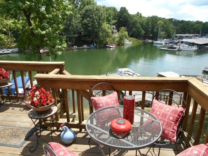 Enjoy the view of Lake Wylie from the deck of this waterfront townhouse in Tega Cay. The townhome has a shared dock for your boat. This home is priced to sell. Come see this spacious 2 bedroom townhouse