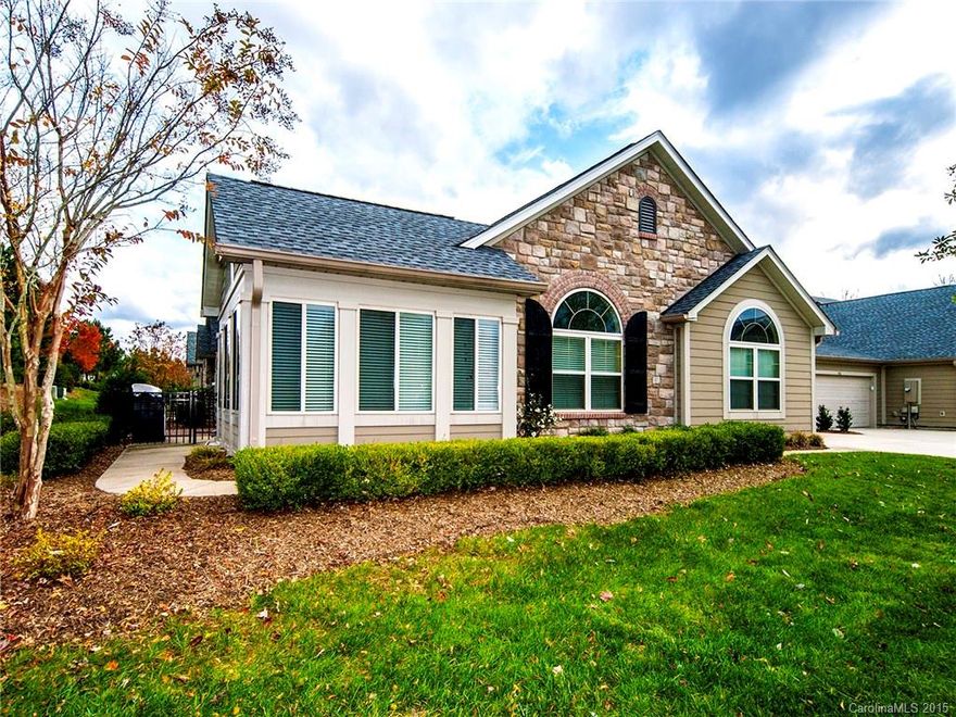 Easy living, one level home with all the bells and whistles.  Convenient location near restaurants and shopping. Desirable open floor plan with hardwood floors throughout main living areas. Cathedral ceilings in kitchen, great room, bedroom and sunroom. The den could be used as a third bedroom.  Drop zone from the garage has extra cabinetry and counter space.  Everything you want: End unit, 2 car garage, fenced porch. Active community with pool, clubhouse and exercise facility.