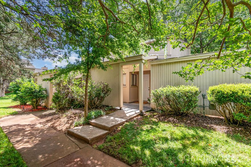 Back to the Market after a complete interior paint job. This is a Wonderful opportunity in desirable Raintree. The open floorplan makes this home feel modern & spacious. Home features updated kitchen w/pantry & plenty of cabinet and counter space plus pass-thru to Dining Area. Great room features wood-burning fireplace & sliding glass doors to screened porch, perfect for relaxing and entertaining. Powder room on main level is great for guests. Bedrooms are upstairs. Generous primary bedroom w/walk-in closet and access to upstairs deck. Laundry closet is conveniently located on 2nd level. Abundant storage thru-out; linen closet, plus outdoor storage closets off front & back patios. This affordable home is Walking distance to restaurants, shopping and more. Includes (2) assigned parking spaces just steps away from the front door. Excellent South Charlotte Location in Top-rated school district. This home presents a fantastic opportunity for investors or future homeowners looking to secure a home in a prime area. Interior Photos to come...