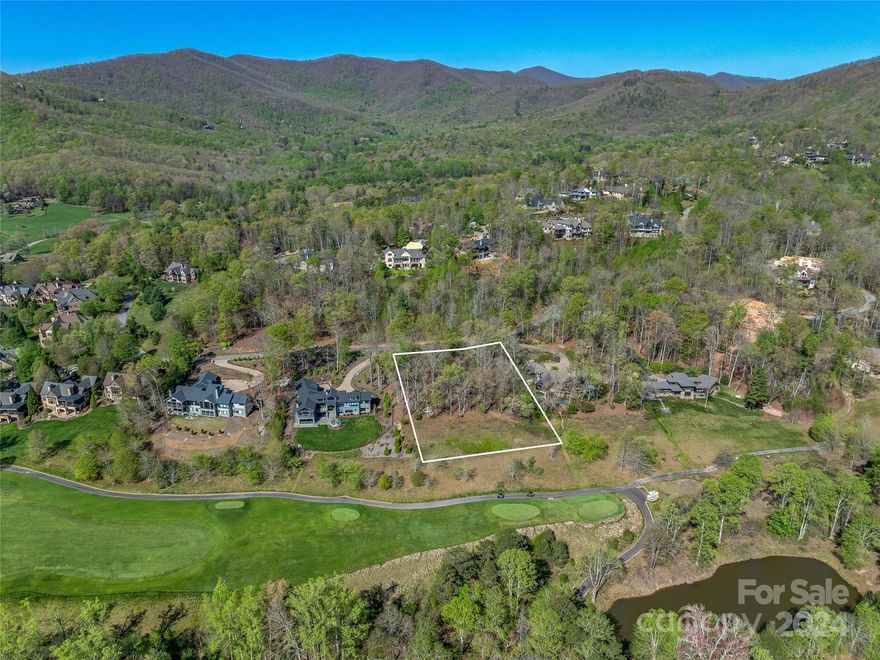 Nestled in the esteemed private gated community, The Cliffs at Walnut Cove, this large lot is one of the last available on the Jack Nicklaus Signature Golf Course and is adjacent to the 1st tee.  With breathtaking views of the surrounding mountains, this  exceptional offers a unique opportunity to craft your own private retreat. The community enhances your living experience with its award-winning golf course and cutting-edge Wellness Center. Members have access to a wide range of outdoor activities, including golf, hiking and biking trails, fishing, and tennis courts, all set against a stunning mountain backdrop. Just minutes from Asheville, you’ll find vibrant arts and cultural events, gourmet dining, and boutique shopping. Whether you’re looking for a permanent home or a vacation escape, this extraordinary lot provides the perfect setting for a luxurious and leisurely lifestyle amid the beauty of the Blue Ridge Mountains.  Seller has complete home plans and site work available.