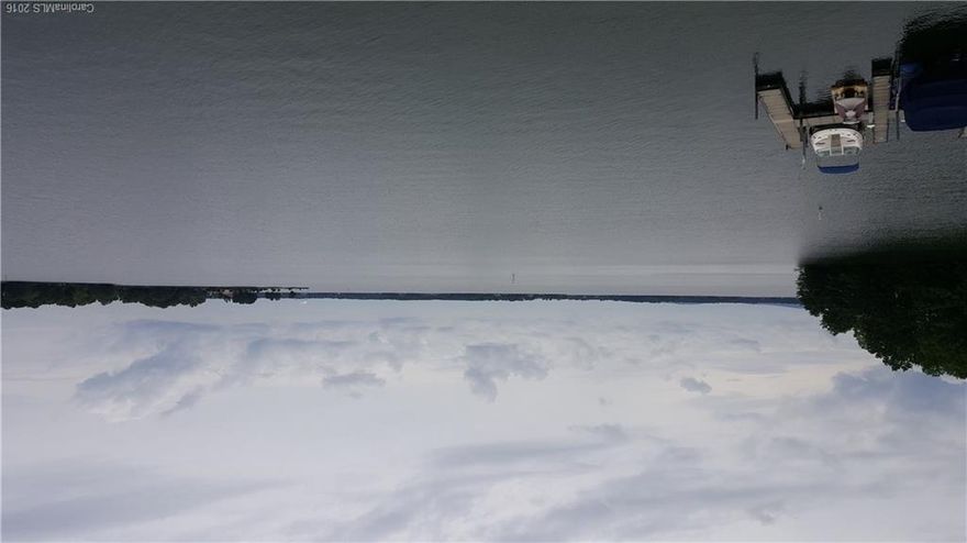 Absolutely incredible views from this spacious waterfront condo. Enjoy the sunset from the large deck. Large bedrooms, updated kitchen/baths. Incredible location! Boatslip is included with the unit. Quiet, private community. No smokers/no pets. Come enjoy Lake Norman!