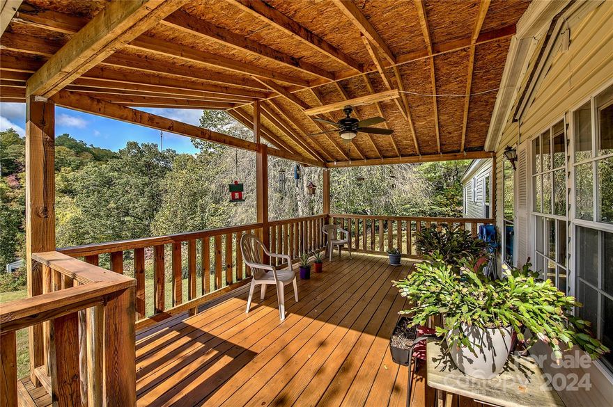 Private home, just outside the city limits with views, comfort & plenty of room! Privacy without remoteness & convenience without the crowd. 1 mile from regional hospital. This excellently maintained 4BD/2BA home on 1.62 acres features an open living style & spacious KT w/ well appointed cabinetry, island, central DN area, LV room w/ gas log fireplace, large GR for plenty of family & friends, large guest BDs, master BD features walk-in closet, duel vanities, walk-in shower, garden tub, laundry/mud room on the main, & a grand wooden covered deck presenting the magnum opus for summertime entertainment, easy & gradual steps at rear covered entry. Permanent foundation, new HVAC, & metal roof (5yr.), new oil furnace w/ above ground TK. Furniture Optional. Plenty of parking, two utilities bldgs. & garden area. Your place in these mountains is calling your name. 1 min. to downtown & hospital, 15 min. to Burnsville, 30 min. to Lake James & I-40, 50 min. to Asheville, and 2 hrs from Charlotte.