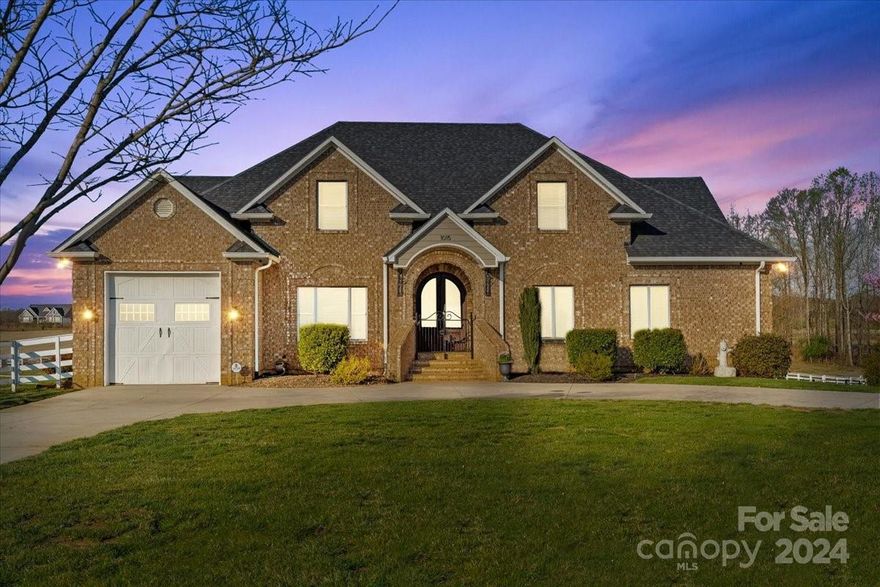 Equestrian neighborhood, 25 minutes to the Tryon Equestrian center!! Welcome to 1015 Cross Country Lane, Inman SC, located in "The Crossings" neighborhood! Inside this beautiful all brick home, you will find three comfortable levels of living! Main floor owners suite with a very spacious bathroom and walk in closet. Main floor boosts a half bathroom, very detailed eat in kitchen, with separate dining room, sitting room, additional bedroom, a large family room with oversized trey ceilings, and a spacious laundry room with a sink and plenty of room for storage! Enjoy three separate doors to the balcony, from kitchen, family room, and master suite. Upstairs provides three addition bedrooms, bonus room, and two full bathrooms. The basement was completed in 2021 and is 1,933 sqft. Full Kitchen with quartz countertops, dining area, office space, master suite, additional full bath, family room & storage space. Well maintained barn w/ upstairs workshop space!