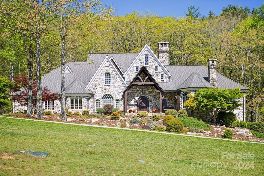 This exquisite estate near Boone, NC, and the Blue Ridge Parkway offers 128 deeded acres of unparalleled privacy and luxurious features. The Cumberland Fieldstone timber-frame home includes 5 bedrooms, 5 bathrooms, a stunning 38-foot great room ceiling, and a master suite with his-and-her baths, a jetted tub, heated floors, and a slate patio with a hot tub. Enjoy two year-round, spring-fed streams, potential ponds, abundant wildlife, and a private gated entrance with a 12-foot wide, all-concrete driveway. Features include a 3-car garage with 8-foot doors, a barn with a 2-car garage and loft, wood and slate patio, and immaculate landscaping. The home is equipped with a geothermal system with six units, 600 amp electrical system, and copper gutters. The walkout basement provides ample storage, a storm shelter, and a utility room with a poured concrete floor and humidifier. This one-of-a-kind property offers an extraordinary lifestyle. Contact listing agent for a full listing description.