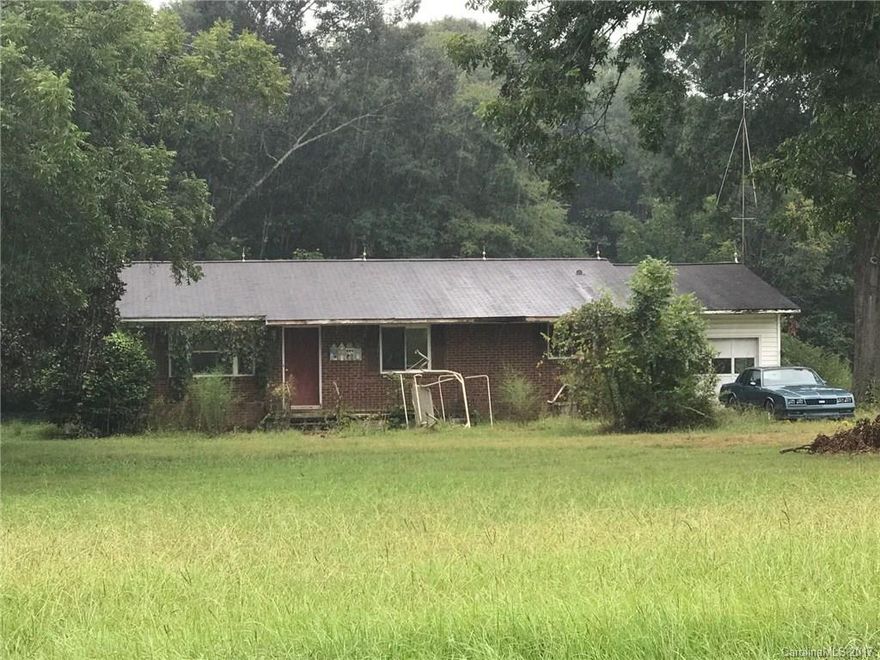 3 Bedroom 2 bath needs complete remodel. Almost 2.85 acres. House has potential.