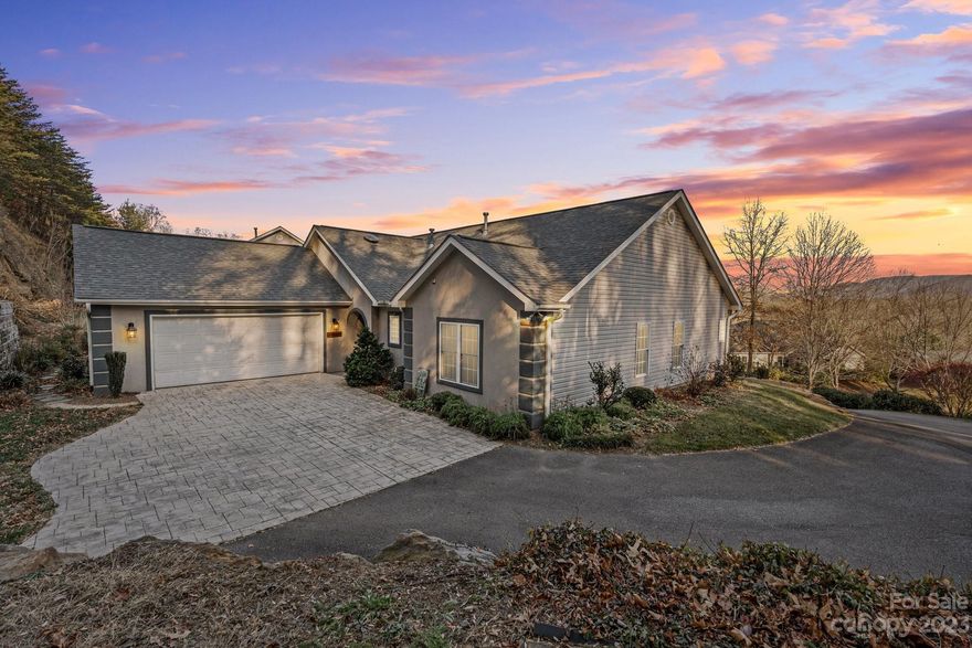 Single level living in convenient Stonebridge community in Haw Creek. 5 minutes from Downtown, Whole Foods, Ingles, & the Blue Ridge Parkway. Sunny bright lot w/ Eastern and Southern orientation sits up high in the community & offers beautiful seasonal mountain views. Low maintenance yard includes custom rock hardscaping & beds for flowers, herbs and perennials. Expanded two car garage provides easy access to the home as well as storage. Spacious and open floorplan includes a great room with vaulted ceilings & a bright spacious sunroom. Large primary bedroom suite w/ large walk-in closet & spacious bathroom w/ jet tub & updated shower. Two additional bedrooms w/ convenient access to a second full bathroom & large laundry room. Many desirable updates including granite countertops, stainless appliances, updated flooring, new roof & more. The many windows in the living areas with its spectacular views is a rare find in the serene Stonebridge Community.