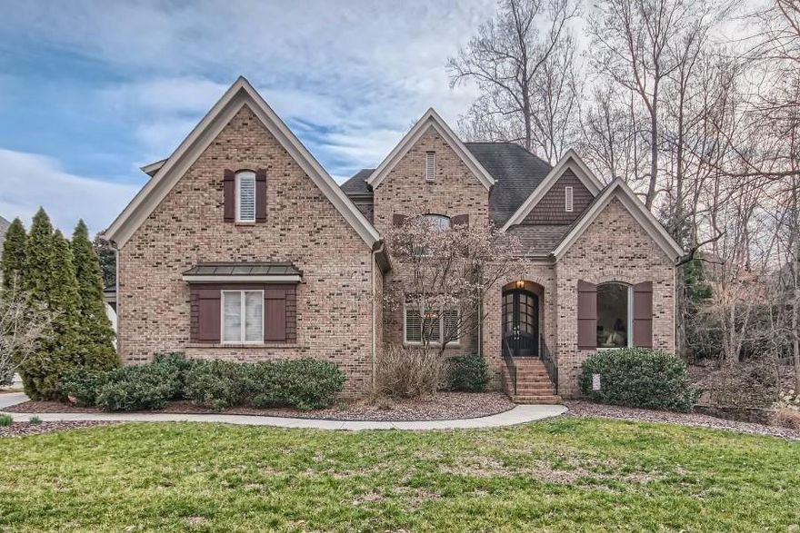 Custom built home in desirable South Charlotte Reverdy Glen. Backyard is a peaceful retreat w/ vail like village view of private custom pools landscaped into the background. Hardwood flooring on main level, architectural detailing, upgraded molding & wainscoting. Formals at front of home used as dining rm, living rm or study/office. This custom home flows w/ease of entertaining & receiving natural light. Gourmet Kitchen w/rich creamy white custom cabinetry, huge center island w/seating space, granite cctops, tile backsplash, gas cooktop, SS appliances, & beautiful kitchen window bring bright & cheeriness to heart of the home.  This home is located on cul-de-sac street w/fenced yard & screened porch. Convenient to amenities & schools this home will be a delight to show.